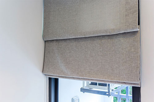 Internal blinds with fabric coverings for stylish window privacy and light control.