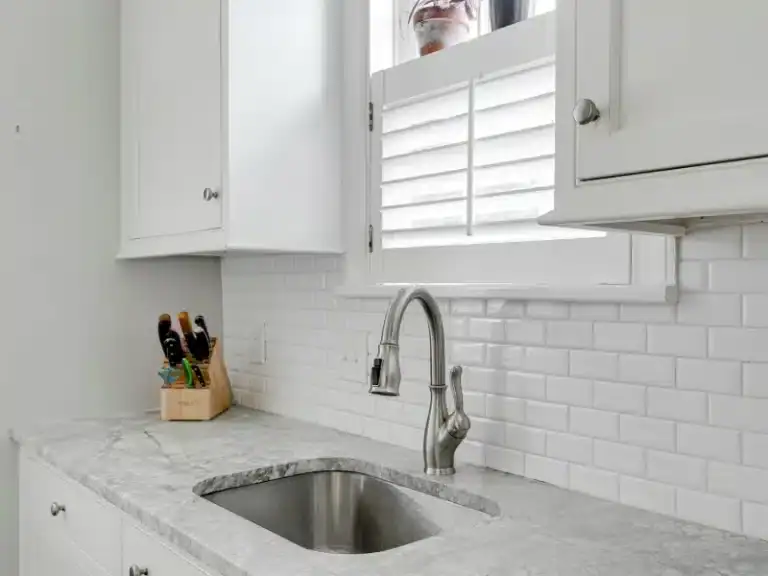 Plantation shutters for kitchen window, stylish and functional window treatment. Perfect for Hills D.